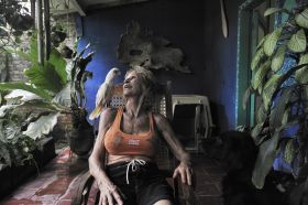 Female expat in NIcaragua with a parrot on her shoulder – Best Places In The World To Retire – International Living
